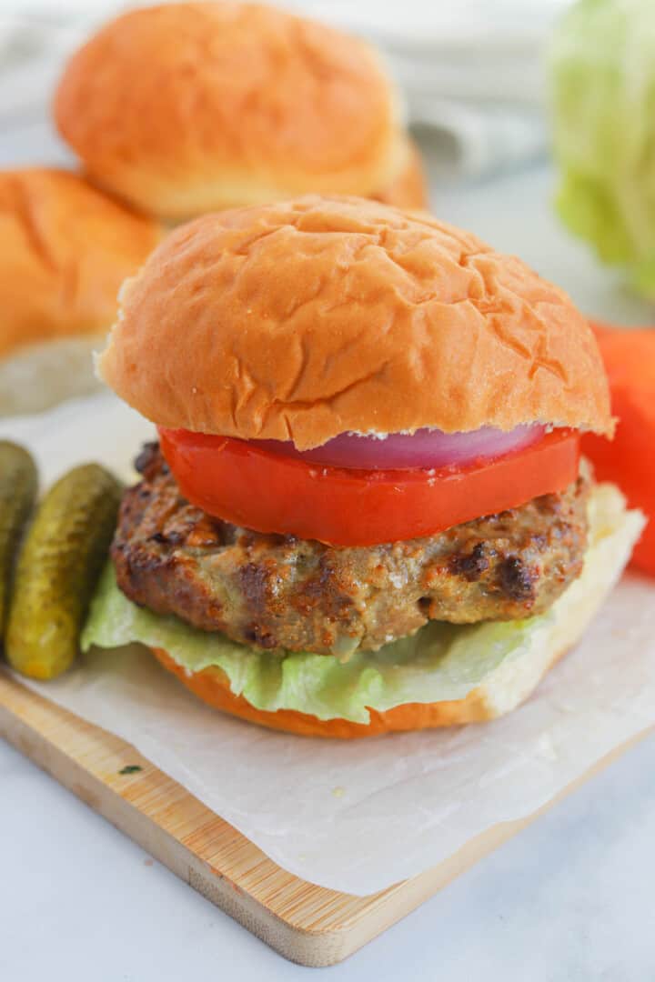 Air Fryer Turkey Burgers on wooden serving board.