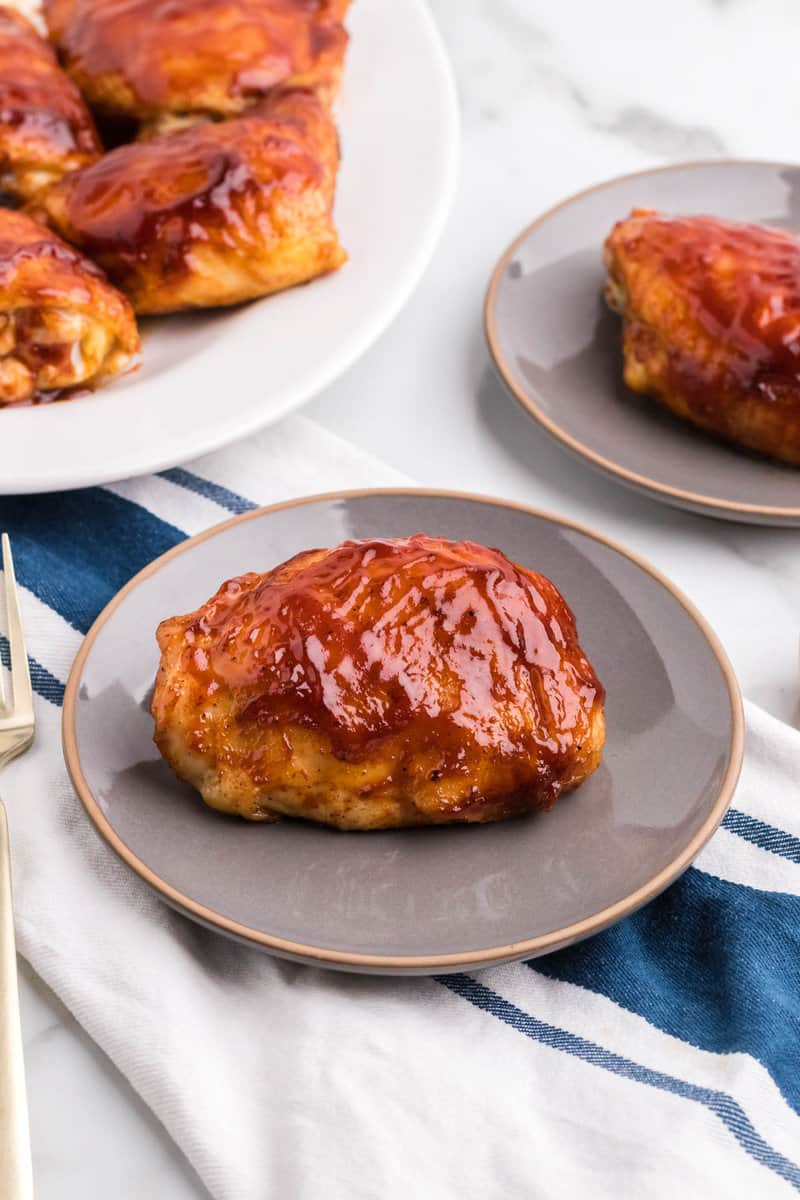 BBQ chicken thigh on plate.