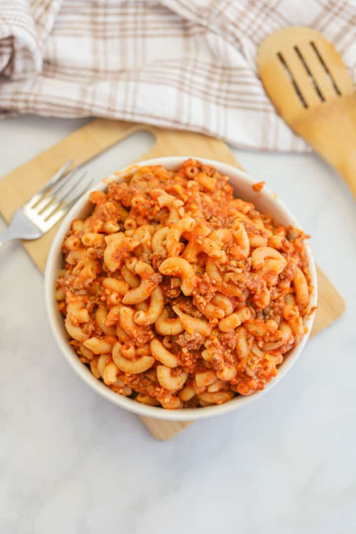 closeup of beefaroni in white bowl.