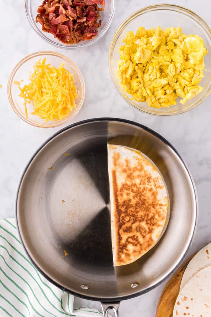 cooked quesadilla in skillet.