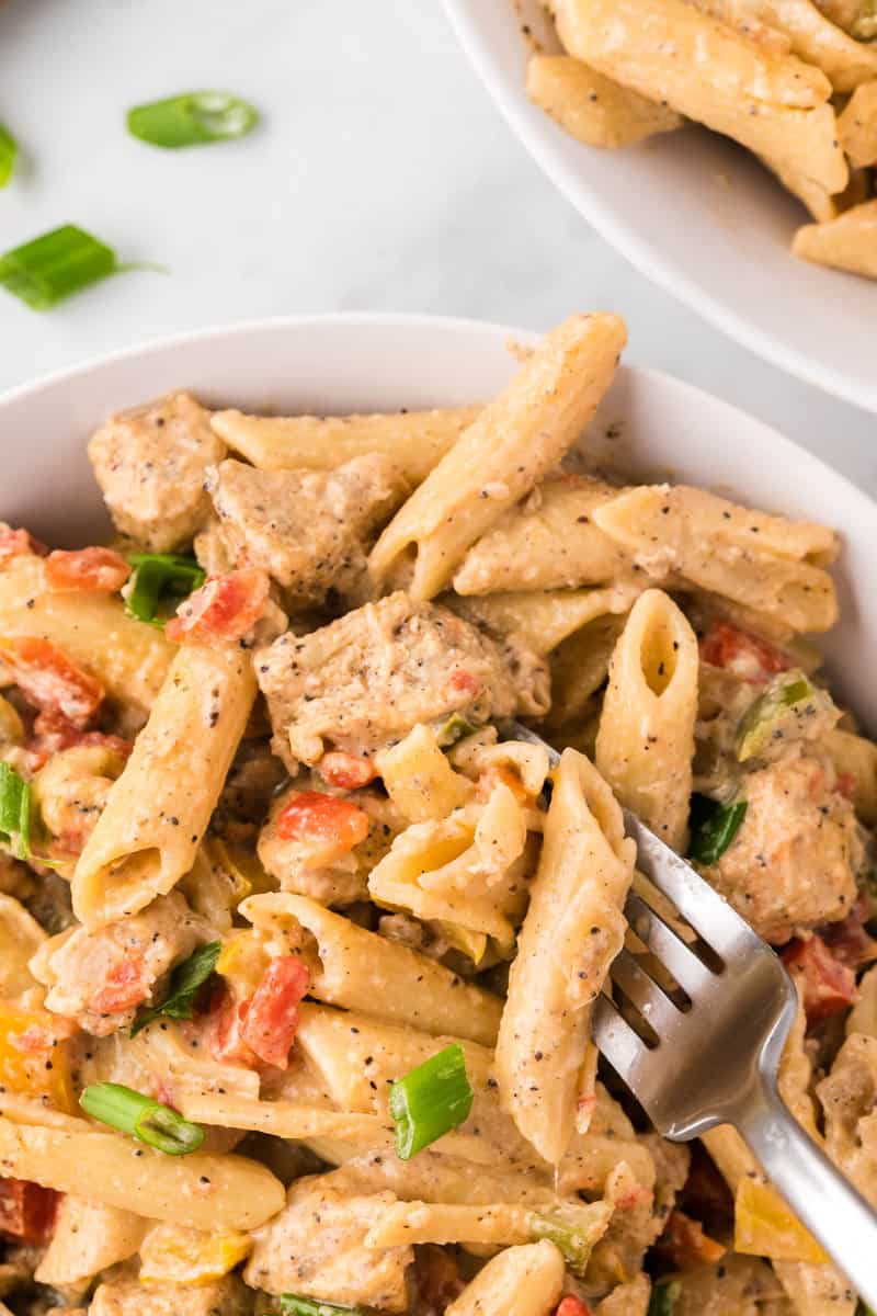 eating pasta with a fork.