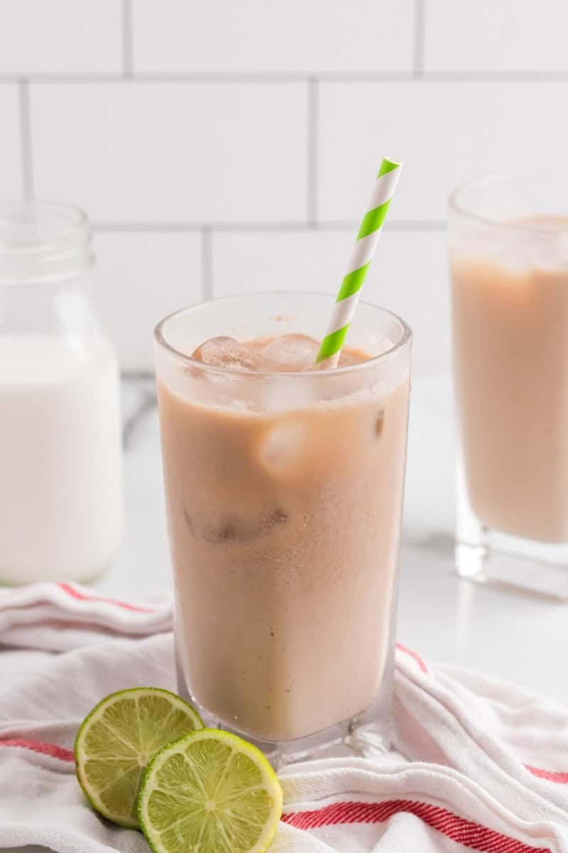 Dirty Soda Recipe in clear glass with green straw.