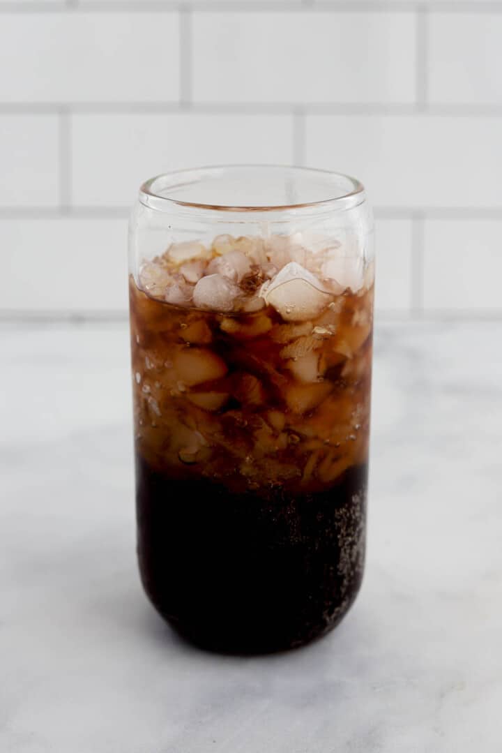glass almost full with crushed ice and soda.