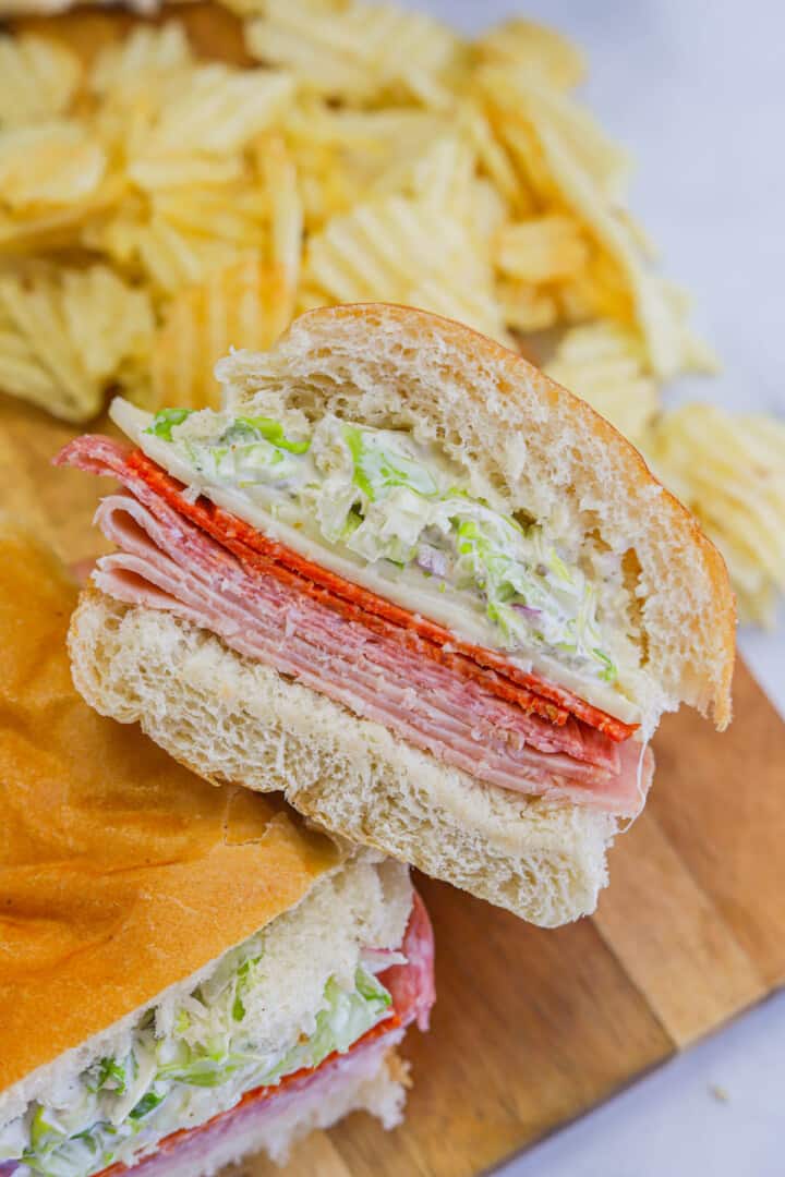 closeup of grinder sandwich on wooden board.