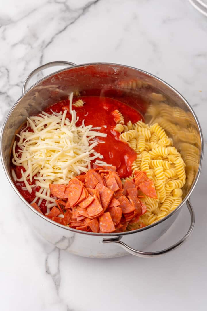 adding the remaining ingredients to the large pot.