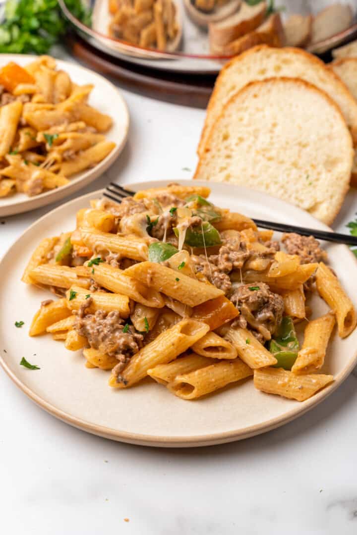 Philly Cheesesteak Pasta on white plate.