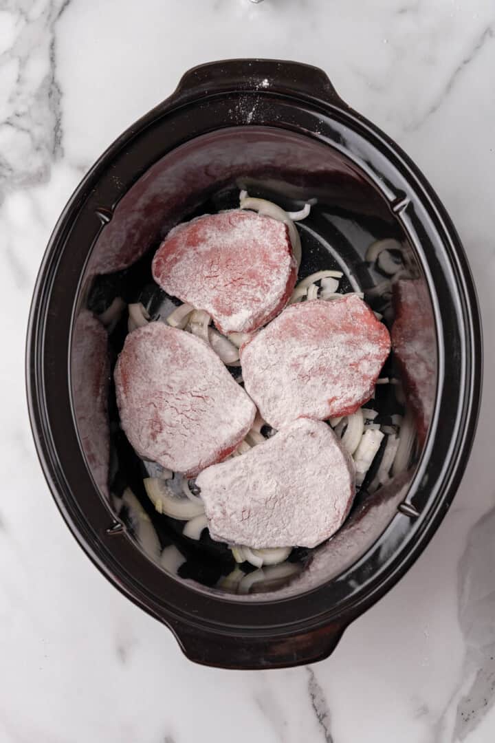 steaks and onions in the slow cooker.