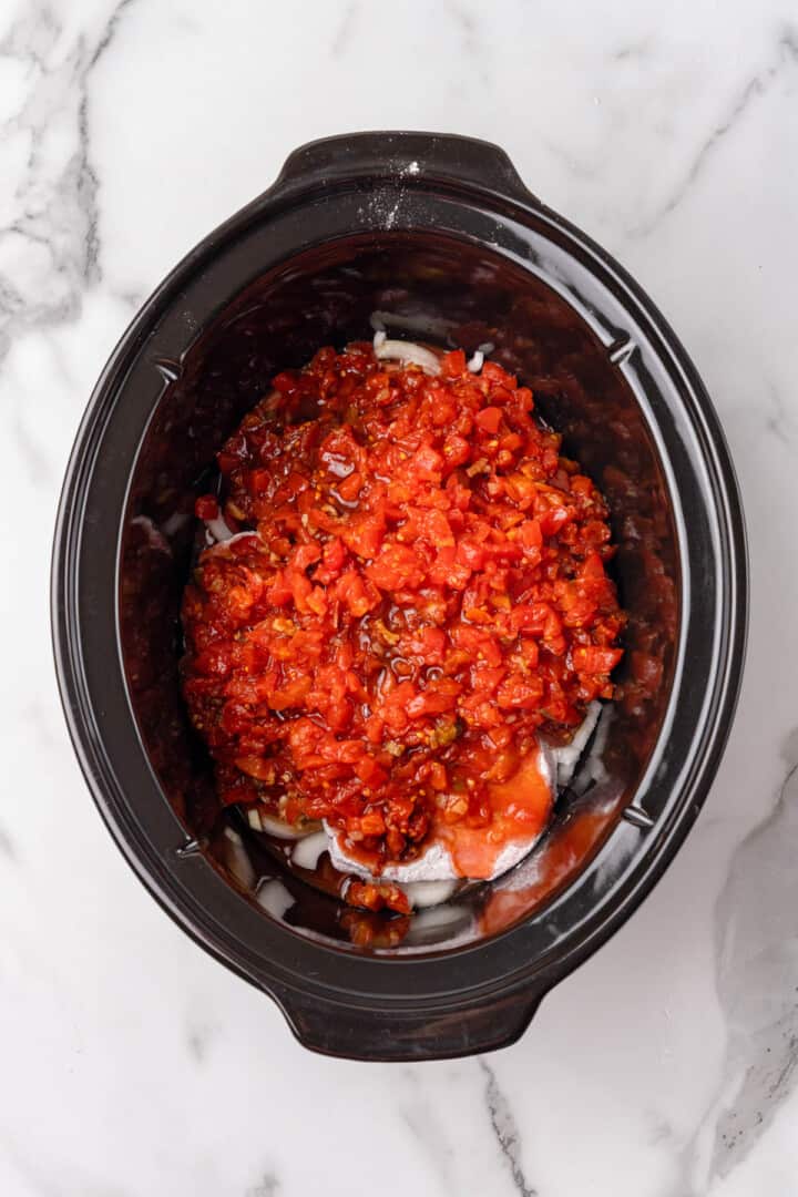 all ingredients for the Swiss steak in the slow cooker.