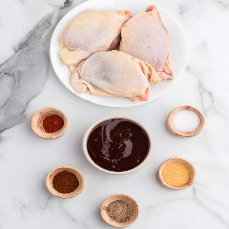 Baked BBQ Chicken Thighs ingredients layer out on the counter.