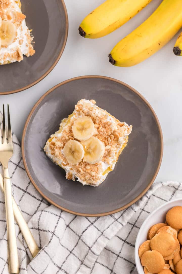 slice of banana pudding poke cake on a plate.