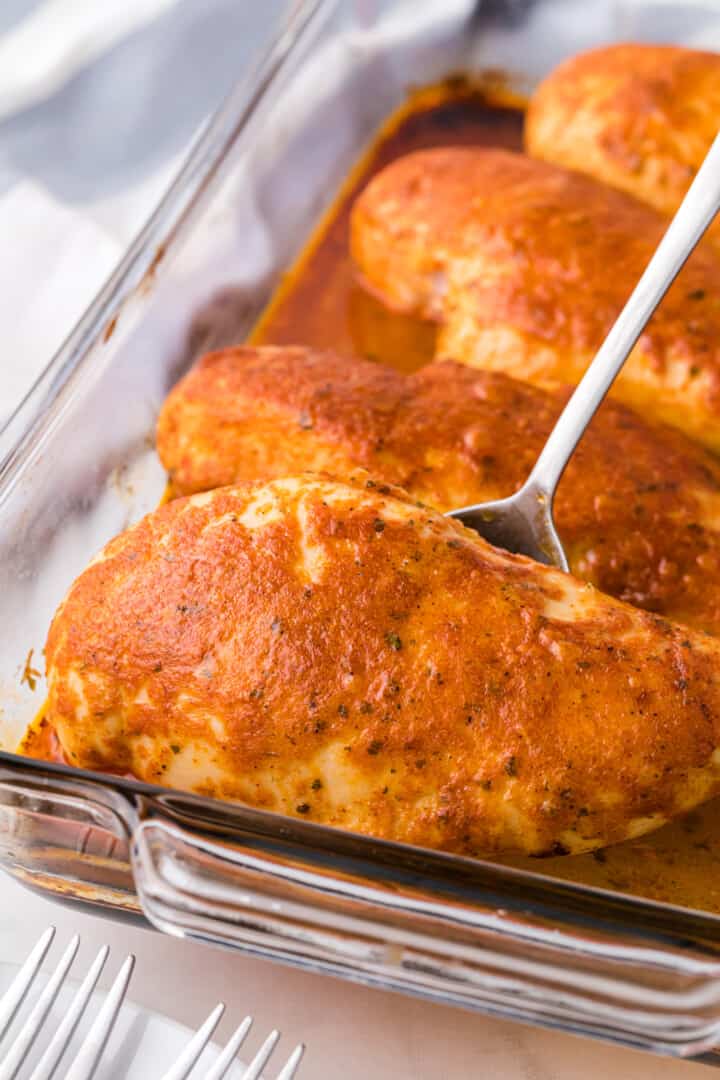 serving the chicken with a fork from the baking dish.