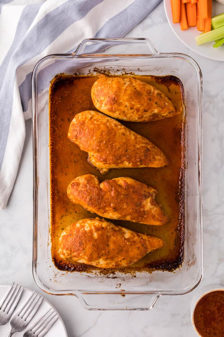 Baked Buffalo Chicken in baking dish.