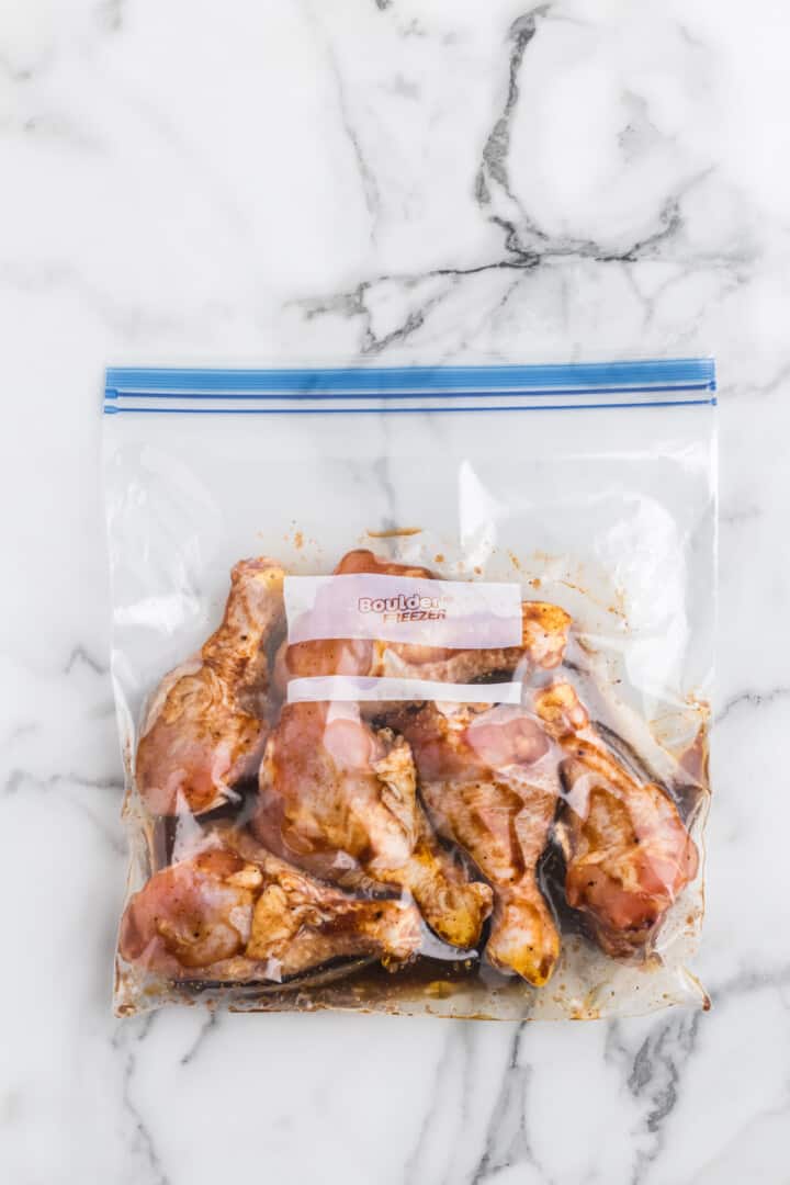 chicken drumsticks marinading in Ziplock bag.