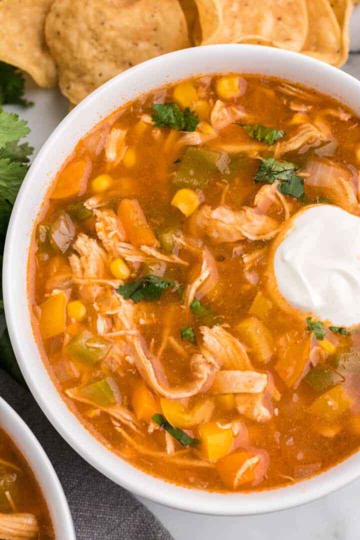 closeup of chicken fajita soup with sour cream.