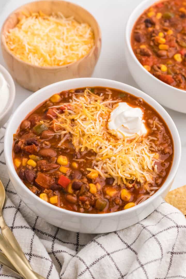 Taco Chili in large white bowls.