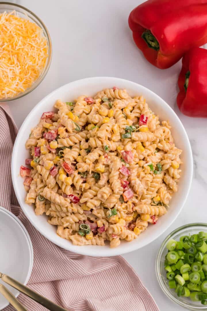 taco pasta salad mixed in large white serving bowl.