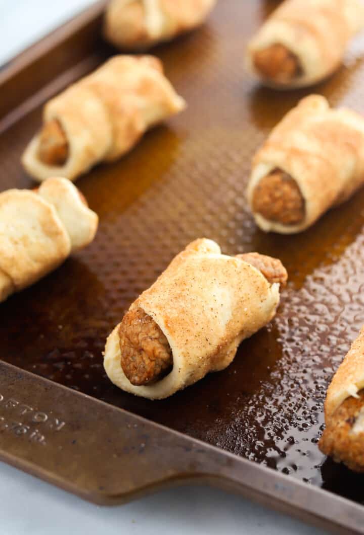 breakfast pigs in a blanket on baking sheet.