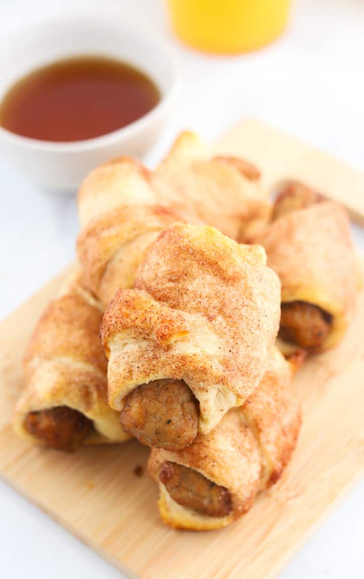 closeup of stacked breakfast pigs in a blanket.