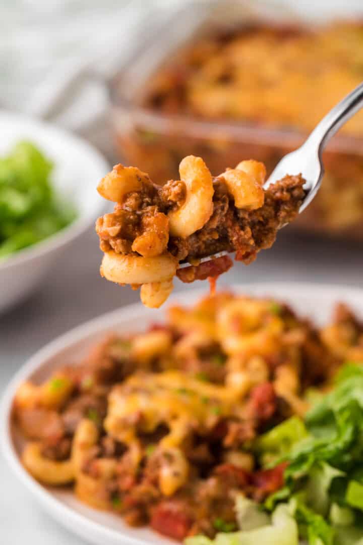 Eating Chili Mac with fork.