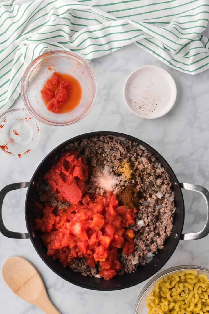 adding remaining ingredients to the ground beef.