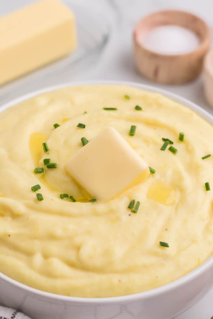 Cream Cheese Mashed Potatoes in white serving bowl.