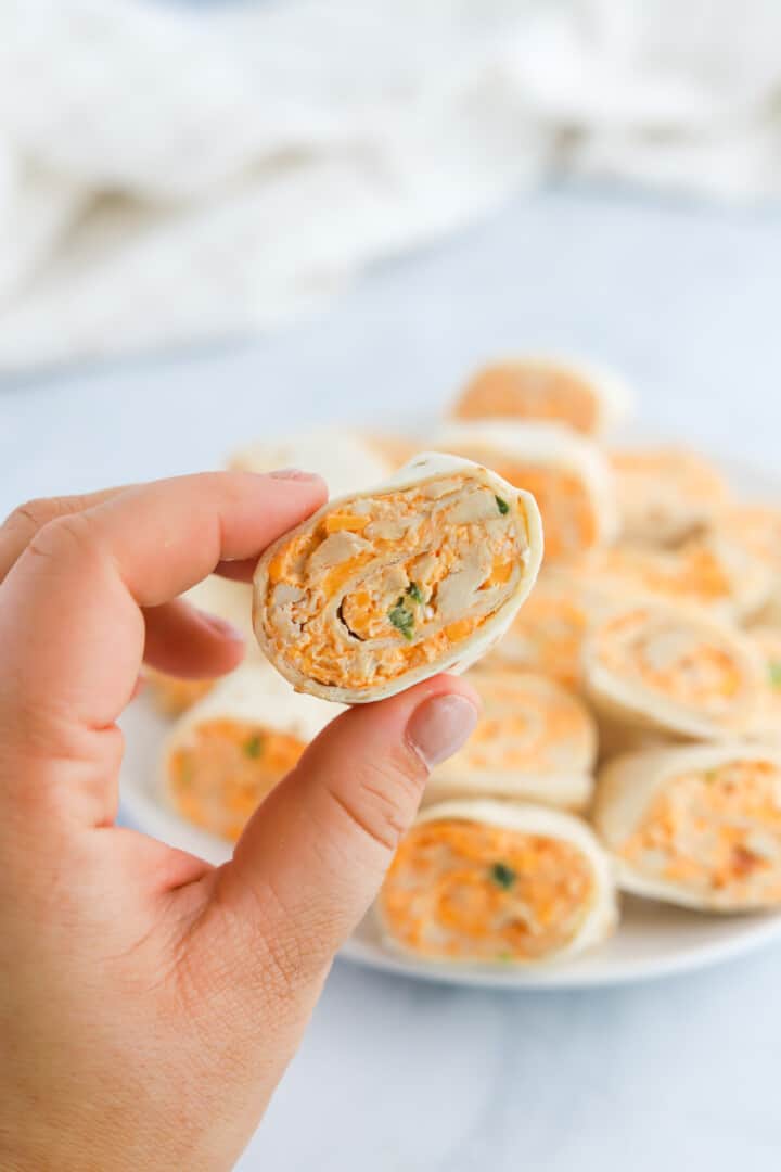 buffalo chicken pinwheels closeup in hand.