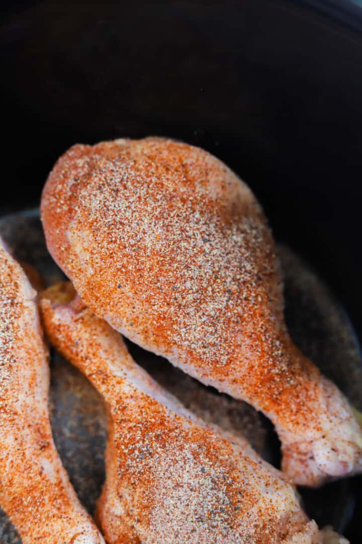 chicken leg rubbed with seasoning.