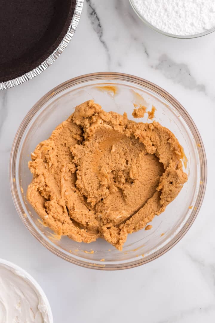 peanut butter and cream cheese mixed together in a bowl.