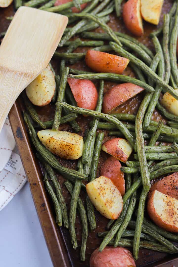 close of up the roasted potatoes and green beans.