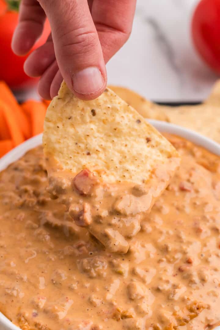 dipping a chip into the Rotel Dip.