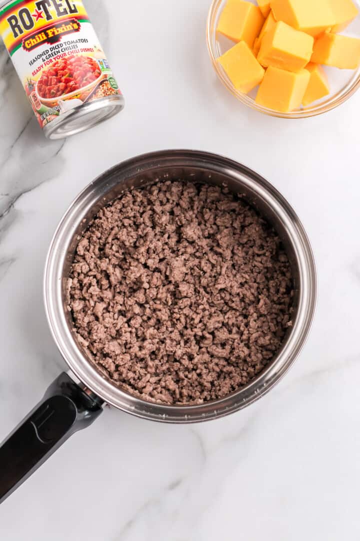 cooking the ground beef in pan.