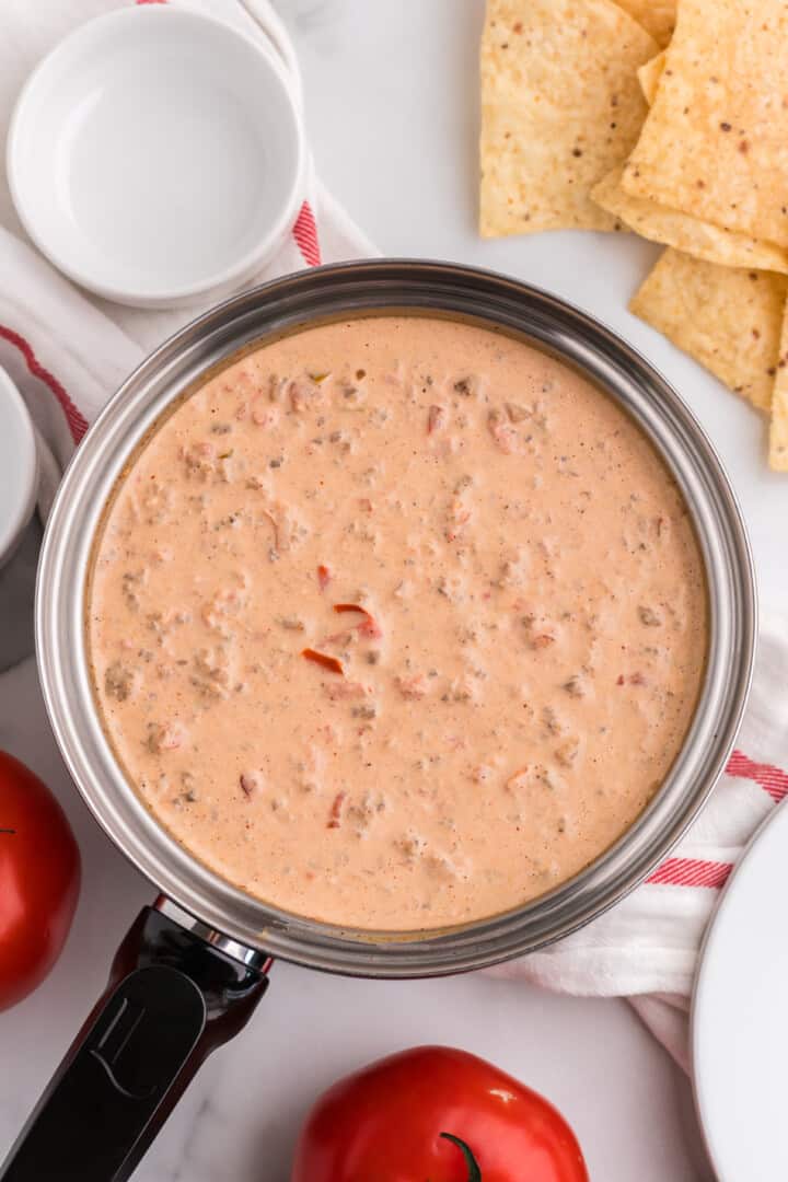 sausage cream cheese dip with Rotel in large sauce pan.