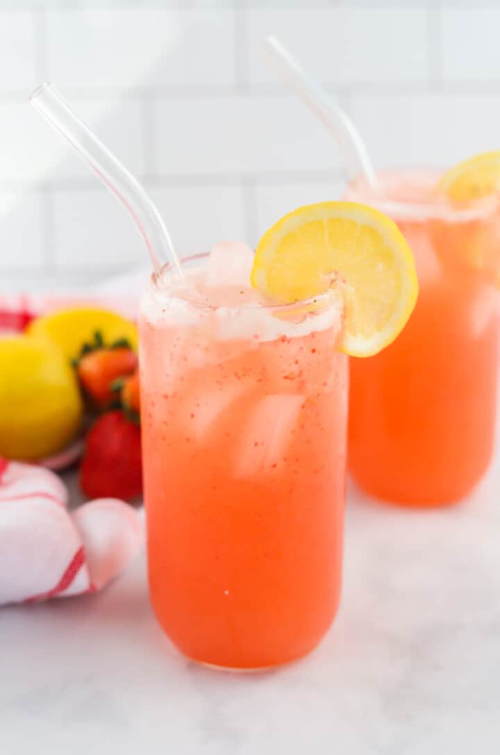 Strawberry Lemonade in glass with lemon slice.