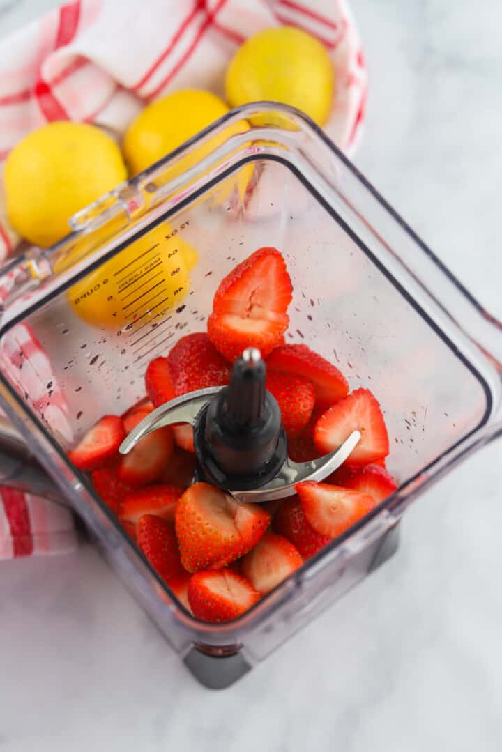 strawberries in blender to make strawberry syrup.