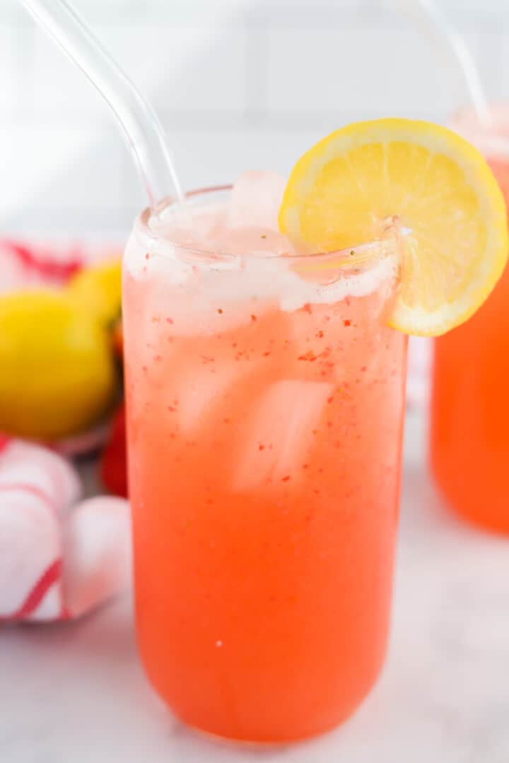 closeup of strawberry lemonade in glass.