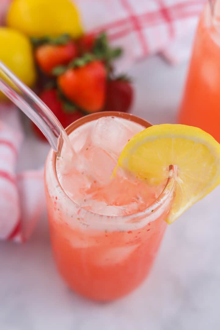 close up top view of a strawberry lemonade in a glass.