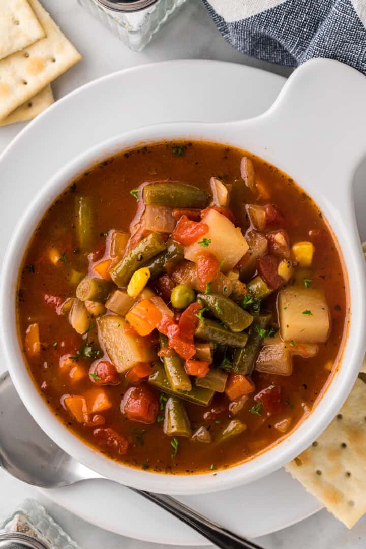 closeup of vegetable soup in the white bowl.