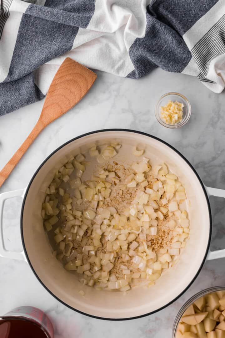 heating oil with garlic and onions in the large pot.