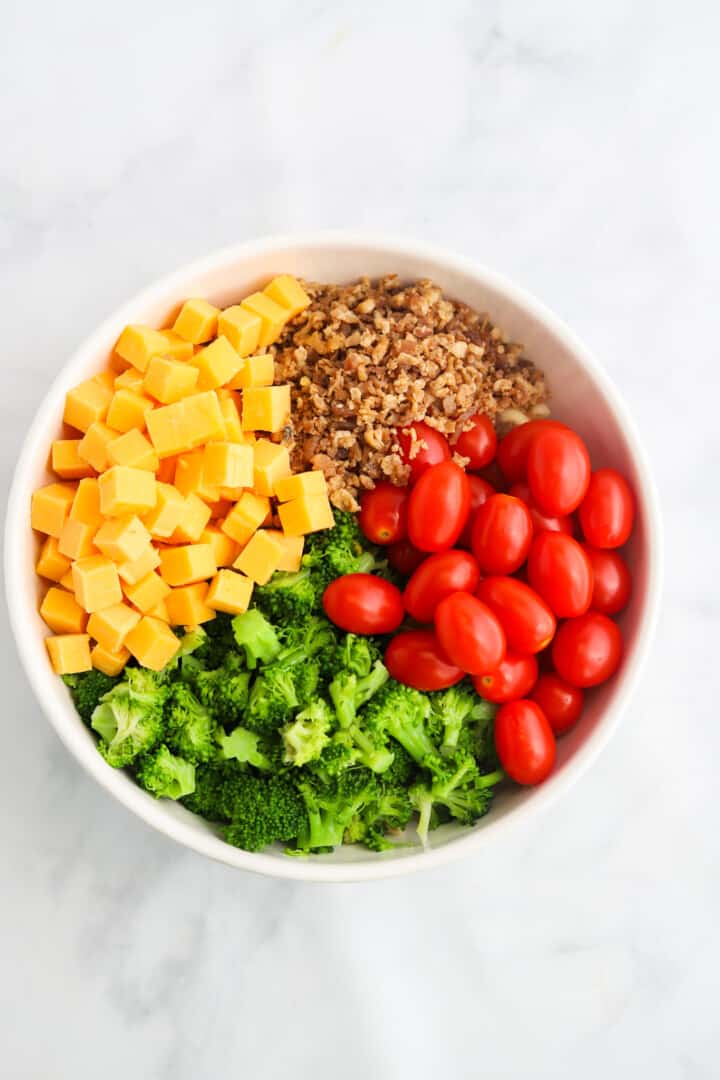 ingredients for the pasta salad in a large mixing bowl.