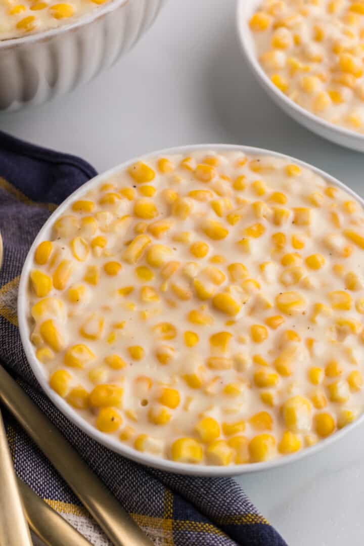 Creamed Corn in white bowl.