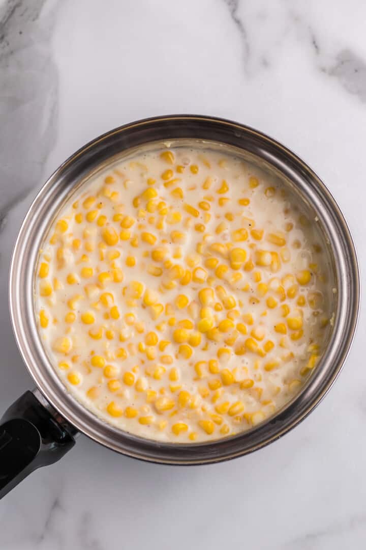 cooked cream corn in saucepan.