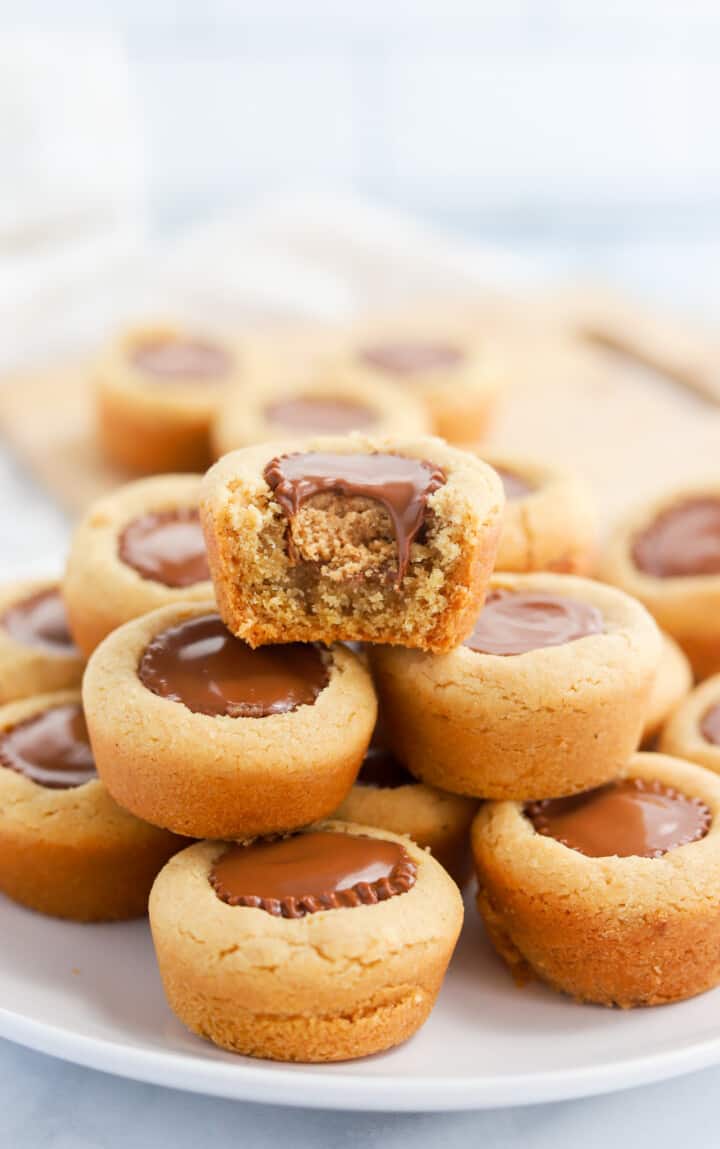 Peanut Butter Cup Cookies stacked on white plate.