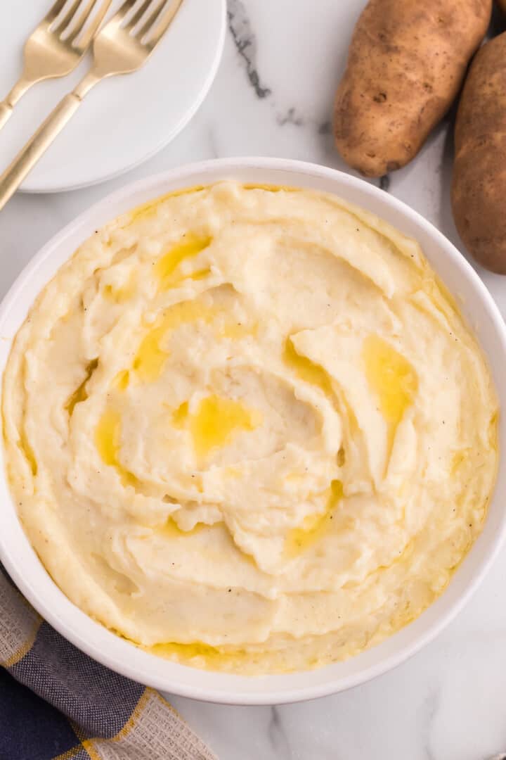 Mashed Potatoes in white bowl for serving.