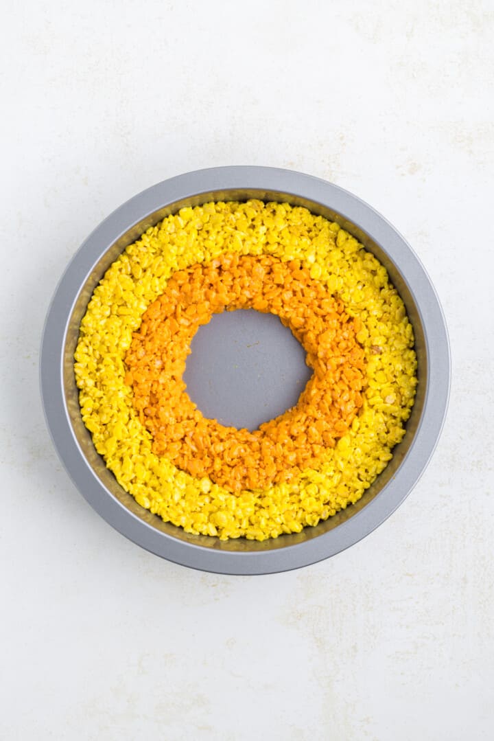 making the orange rice Krispie ring in the baking pan.