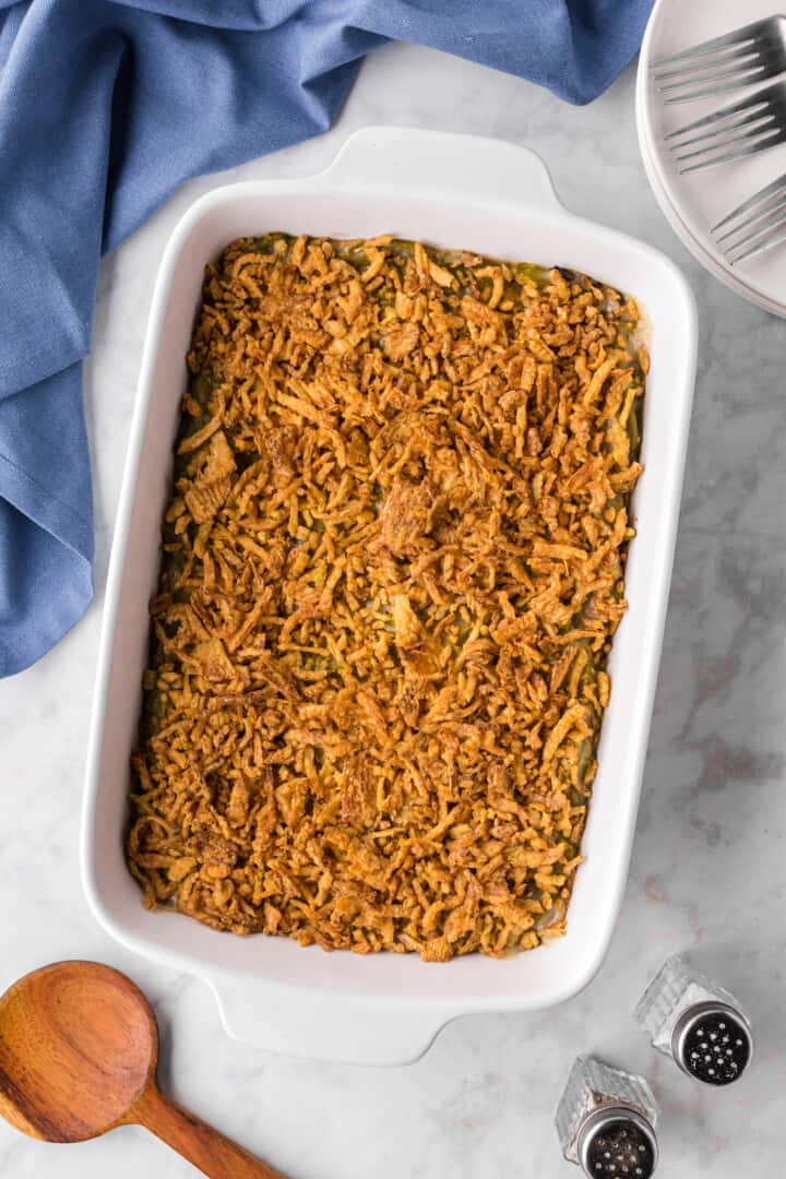 baked green bean casserole in white casserole dish.