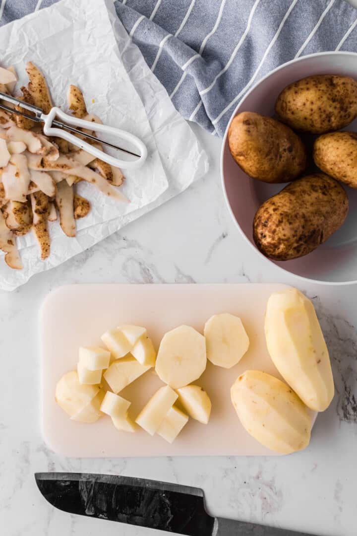 peeling and dicing the potatoes.