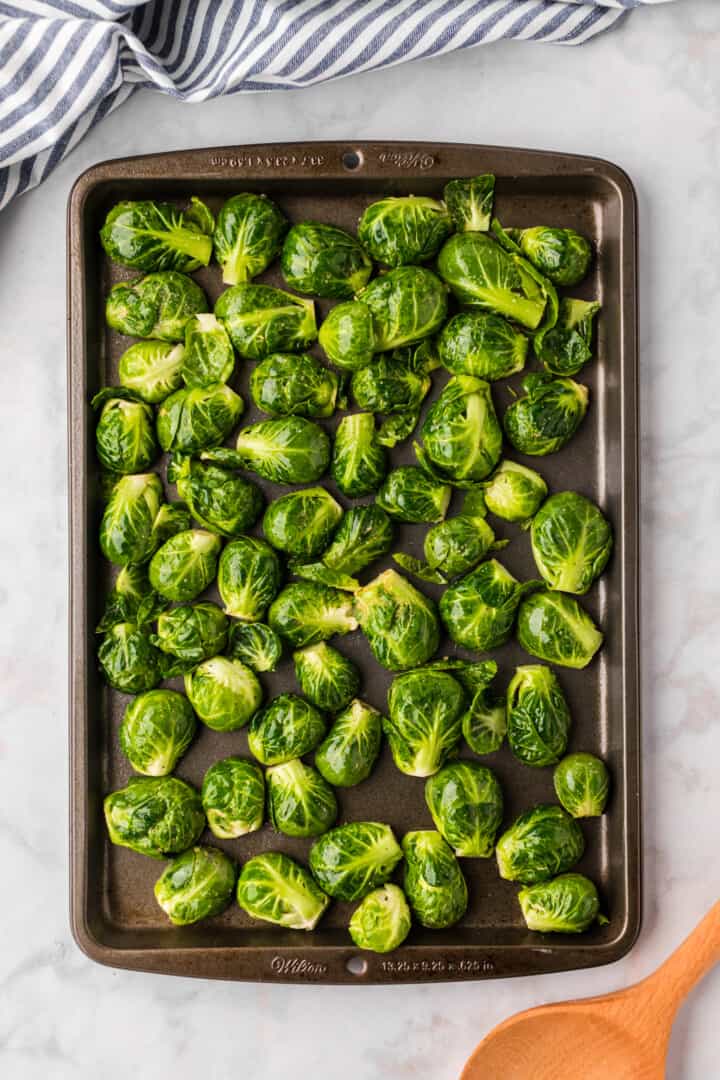 Brussel Sprouts placed on the baking sheet.