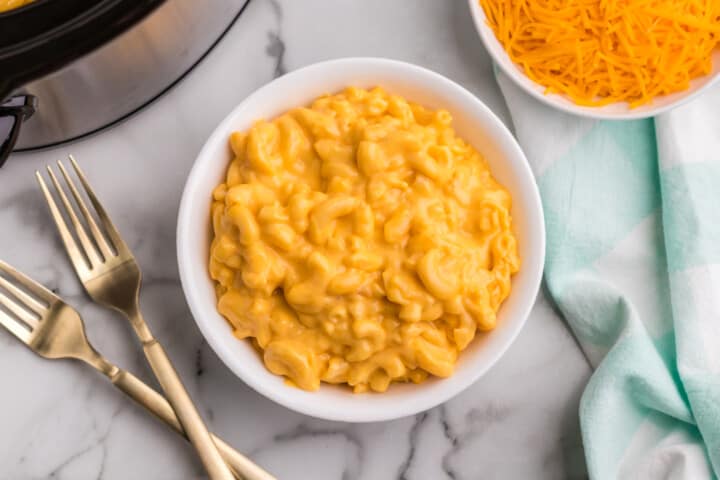 top view of slow cooker mac and cheese in a white bowl.