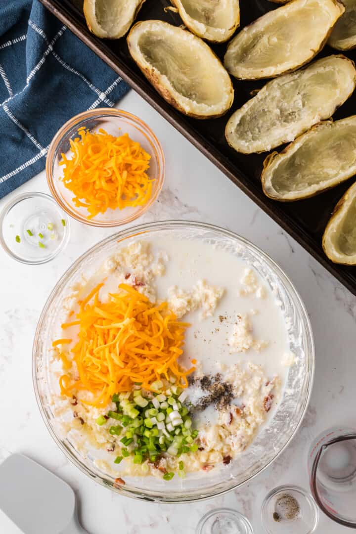 adding the remaining ingredients to make the filling for the Twice Baked Potatoes.