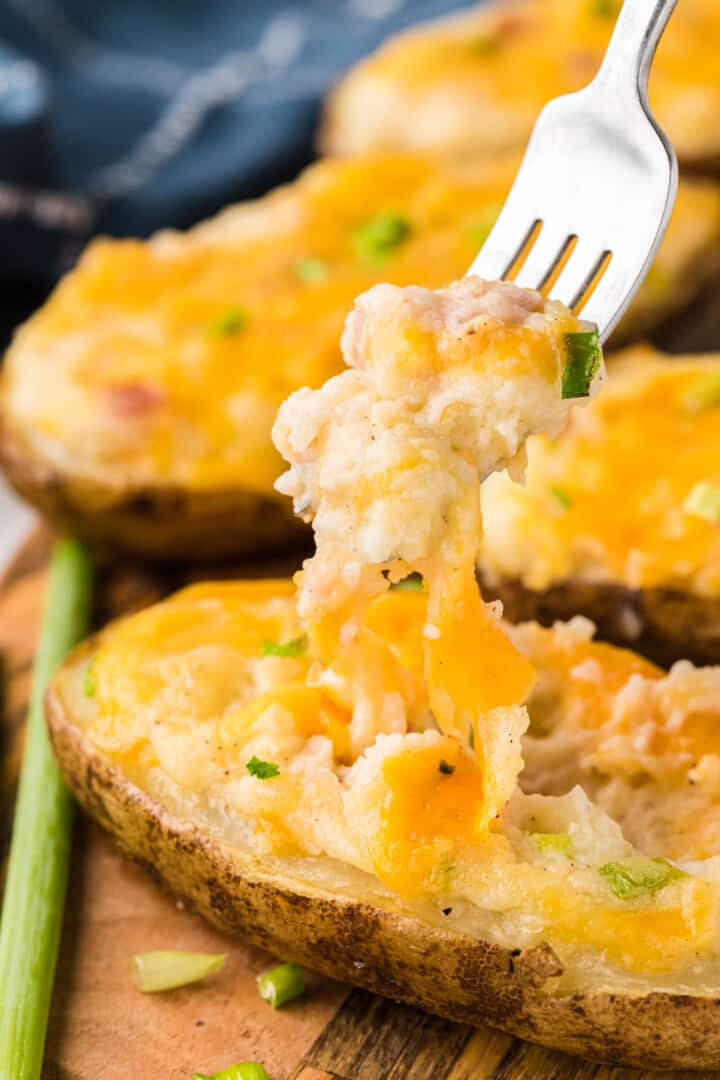 eating the Twice Baked Potatoes with a fork.